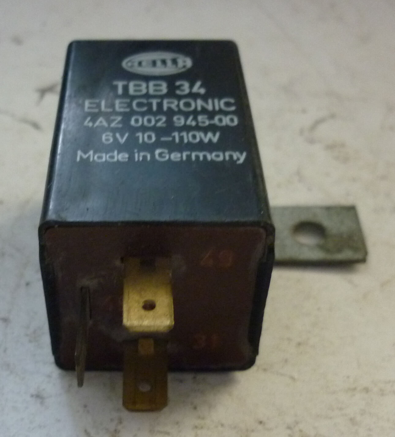 Electronic indicator relay with bracket, HELLA, TBB 34, Vespa P X80-200 / PE / Lusso / T5 / Cosa