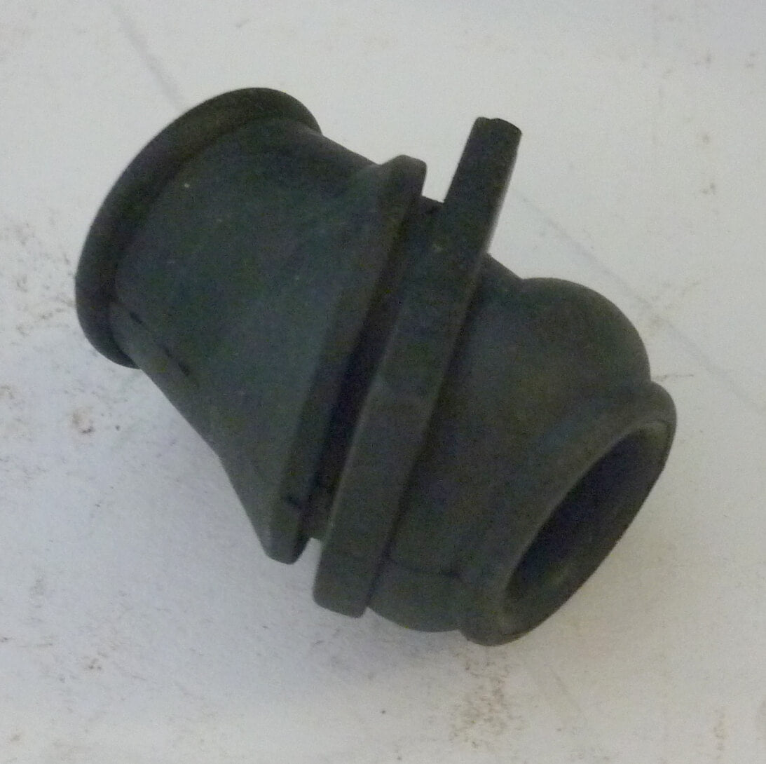 Grommet for petrol pipe trough air filter case