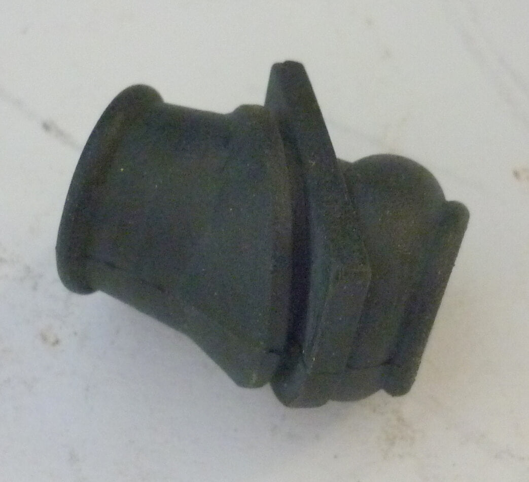 Grommet for petrol pipe trough air filter case